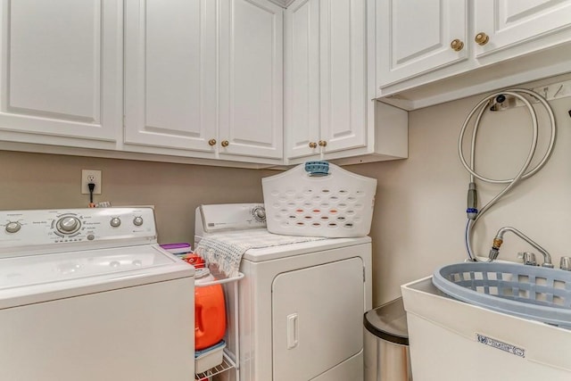 27 Bluff Mountain Dr SW, Rome, GA 30165 - laundry room with cabinet space and washing machine and clothes dryer
