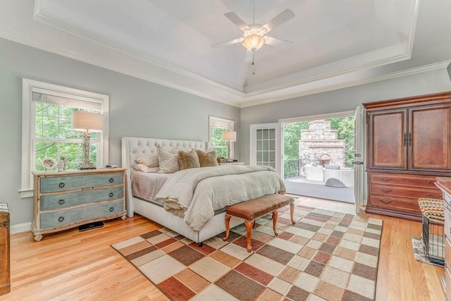 27 Bluff Mountain Dr SW, Rome, GA 30165 - bedroom with a raised ceiling, multiple windows, light wood-type flooring, access to exterior, and ornamental molding