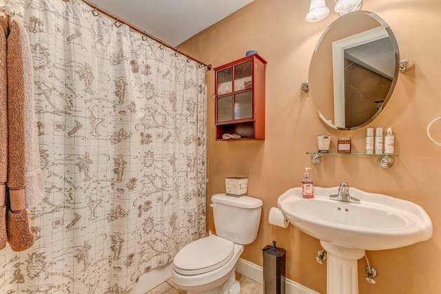 27 Bluff Mountain Dr SW, Rome, GA 30165 - full bathroom featuring toilet, tile patterned flooring, curtained shower, and baseboards