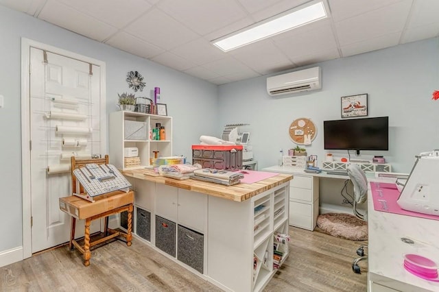 27 Bluff Mountain Dr SW, Rome, GA 30165 - office space featuring a wall unit AC, wood finished floors, and a paneled ceiling