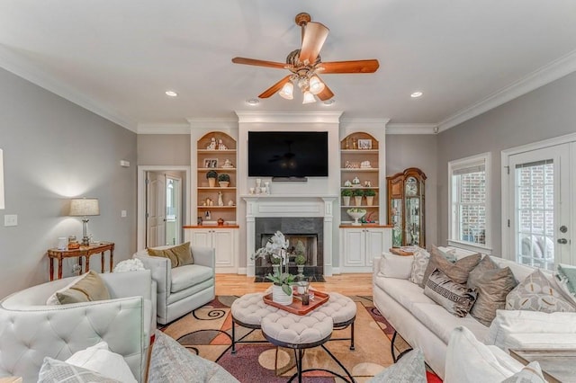 27 Bluff Mountain Dr SW, Rome, GA 30165 - living area with a ceiling fan, ornamental molding, light wood-style flooring, a fireplace, and recessed lighting