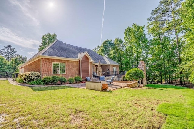 27 Bluff Mountain Dr SW, Rome, GA 30165 - rear view of property with an outdoor hangout area, brick siding, and a patio