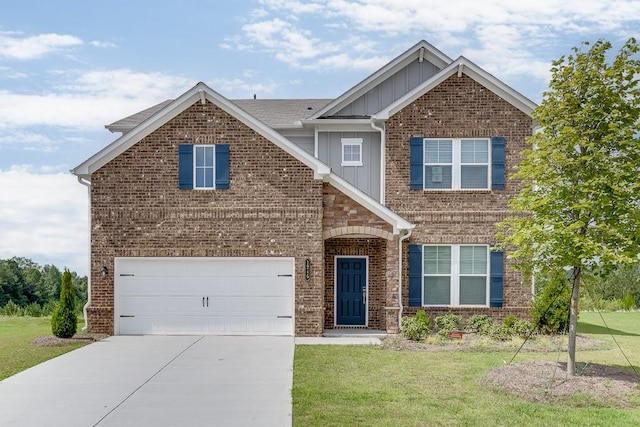 view of front of house featuring a front yard and a garage