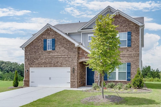 front facade featuring a front yard and a garage