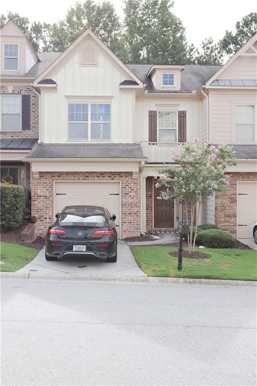 3130 Haynes Park Dr, Lithonia, GA 30038 - view of front of house with concrete driveway, an attached garage, and board and batten siding