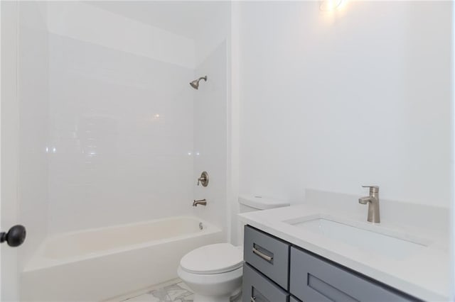 full bath featuring marble finish floor, shower / bathing tub combination, vanity, and toilet