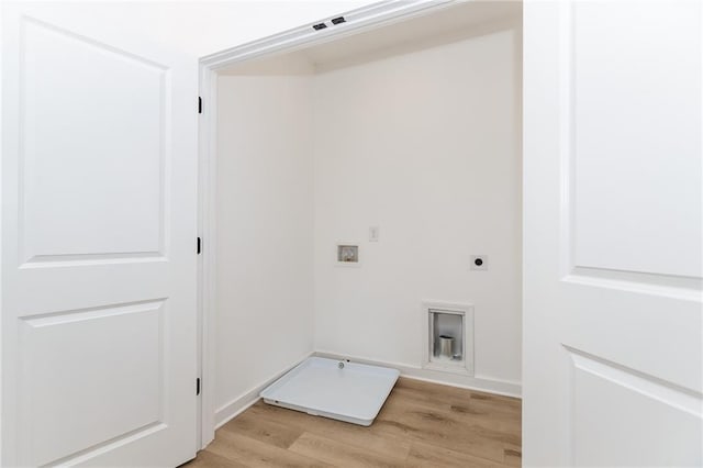 laundry room featuring laundry area, light wood-type flooring, hookup for a washing machine, and hookup for an electric dryer