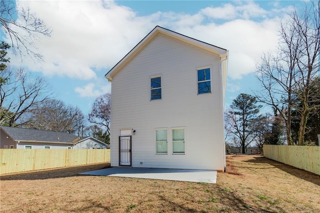 back of house with a yard, a patio area, and fence