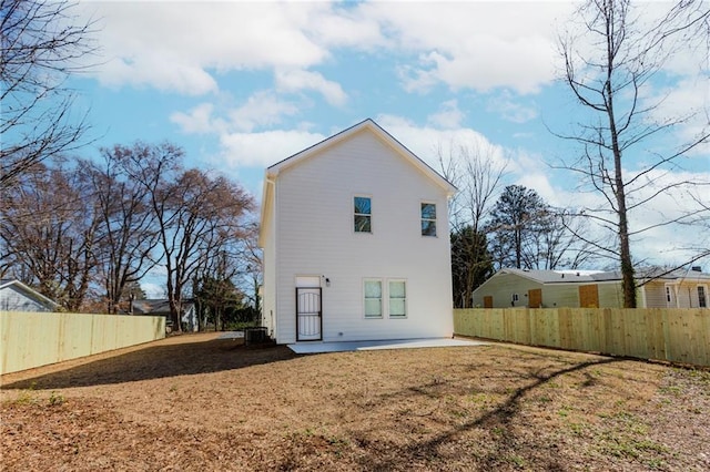 rear view of house with a lawn, a patio area, fence, and cooling unit