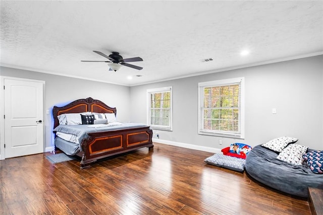 bedroom featuring a textured ceiling, ceiling fan, and dark hardwood / wood-style floors