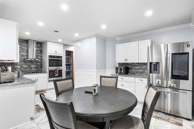 dining area featuring crown molding