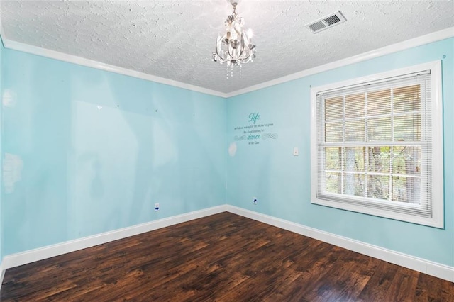 unfurnished room with crown molding, hardwood / wood-style floors, a chandelier, and a textured ceiling