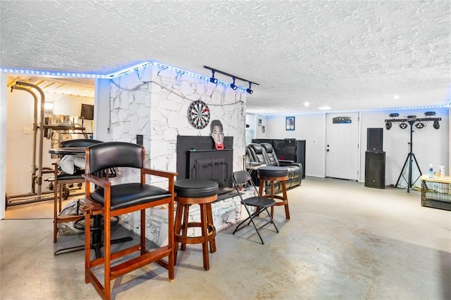 interior space with concrete flooring and a textured ceiling