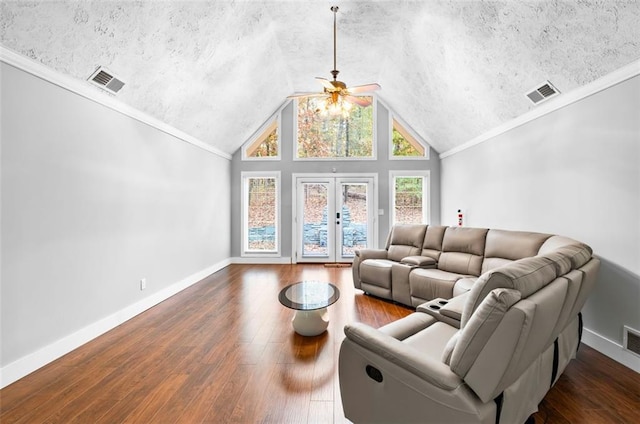 living room featuring dark hardwood / wood-style floors, ceiling fan, lofted ceiling, and ornamental molding