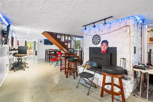 living room with concrete flooring and a textured ceiling