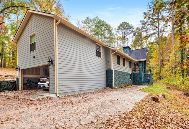 view of side of home with a garage