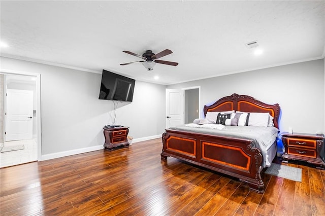 bedroom with ornamental molding, ceiling fan, and dark wood-type flooring