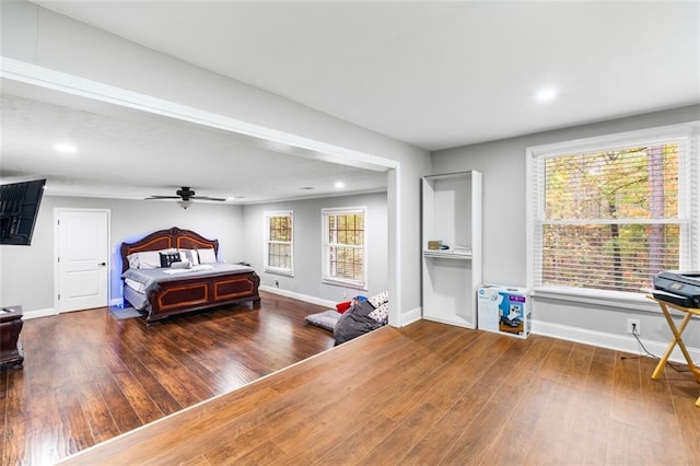 bedroom with dark hardwood / wood-style floors