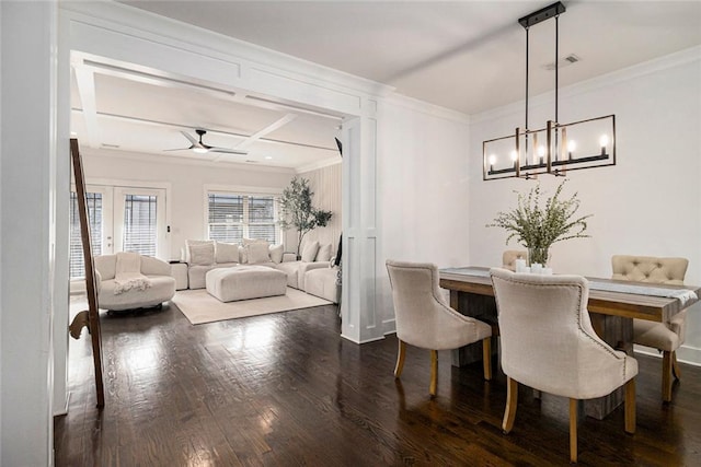 dining room featuring ornamental molding, coffered ceiling, ceiling fan with notable chandelier, and dark hardwood / wood-style flooring