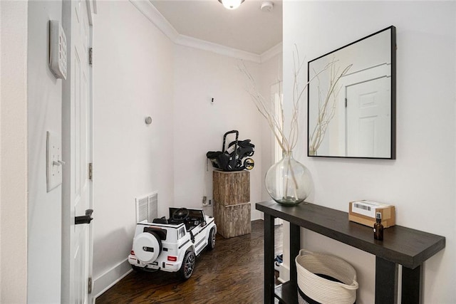 hallway with crown molding and dark hardwood / wood-style floors