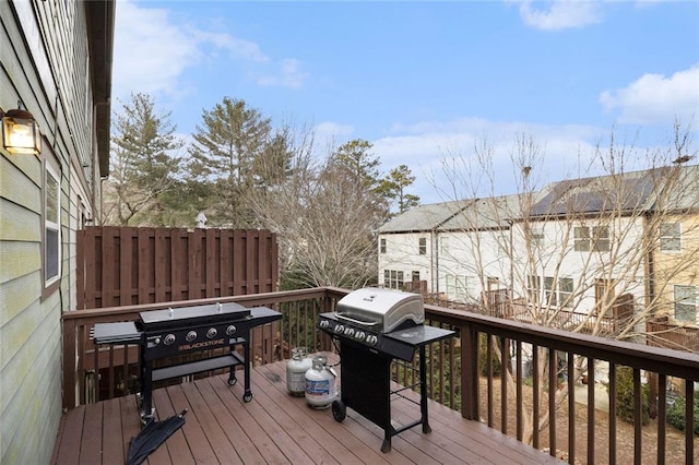 wooden terrace with area for grilling