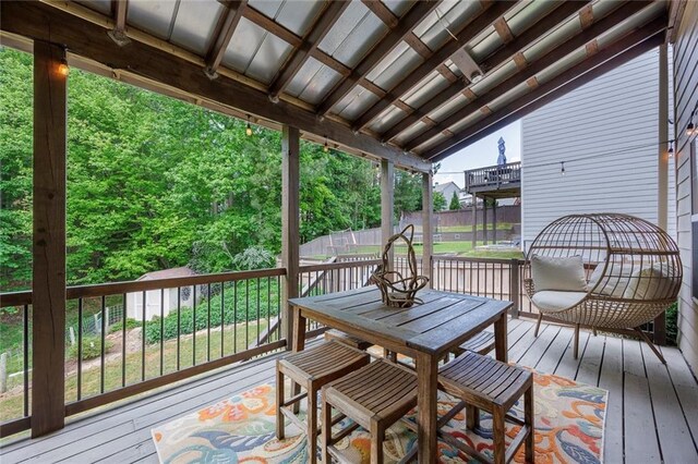 back of house featuring a patio, stairs, a deck, a chimney, and ceiling fan