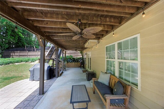 view of patio / terrace with stairway, ceiling fan, fence, and outdoor lounge area