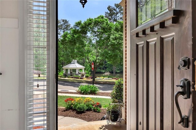 entryway with plenty of natural light and view of wooded area