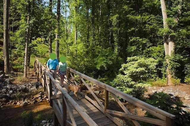 view of home's community featuring a forest view
