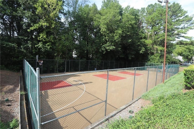 view of sport court featuring community basketball court and fence