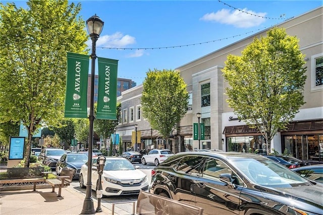 exterior space with sidewalks and street lighting