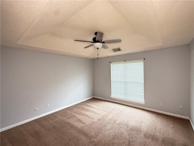 2658 Deann Dr, Ellenwood, GA 30294 - carpeted spare room with a tray ceiling, ceiling fan, and a textured ceiling