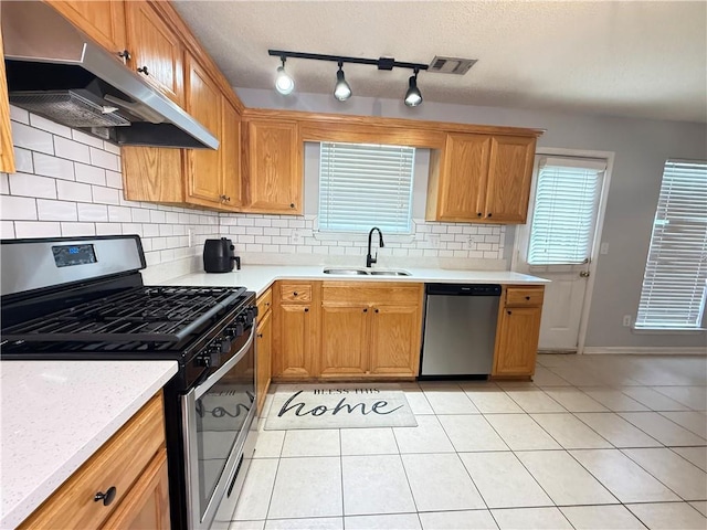 2658 Deann Dr, Ellenwood, GA 30294 - kitchen featuring stainless steel appliances, extractor fan, light countertops, and tasteful backsplash