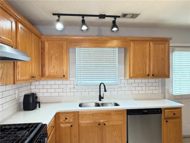 2658 Deann Dr, Ellenwood, GA 30294 - kitchen featuring dishwasher, under cabinet range hood, light countertops, and gas range