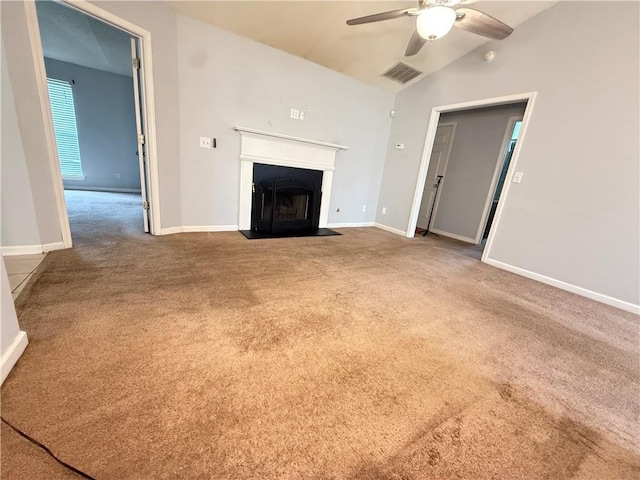 2658 Deann Dr, Ellenwood, GA 30294 - unfurnished living room with a ceiling fan, carpet floors, a fireplace with flush hearth, and lofted ceiling