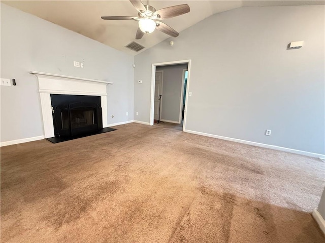 2658 Deann Dr, Ellenwood, GA 30294 - unfurnished living room with lofted ceiling, a ceiling fan, carpet floors, and a fireplace with flush hearth