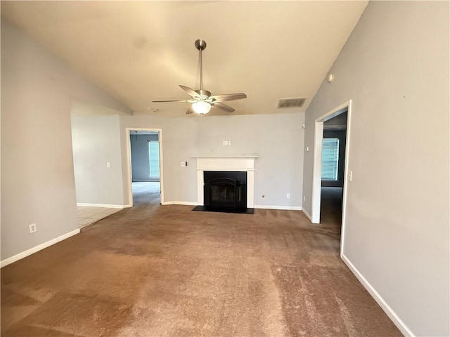 2658 Deann Dr, Ellenwood, GA 30294 - unfurnished living room with a ceiling fan, carpet, and a fireplace with flush hearth
