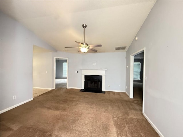2658 Deann Dr, Ellenwood, GA 30294 - unfurnished living room with ceiling fan, a fireplace with flush hearth, carpet, and lofted ceiling