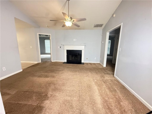 2658 Deann Dr, Ellenwood, GA 30294 - unfurnished living room featuring a ceiling fan, carpet, and a fireplace with flush hearth