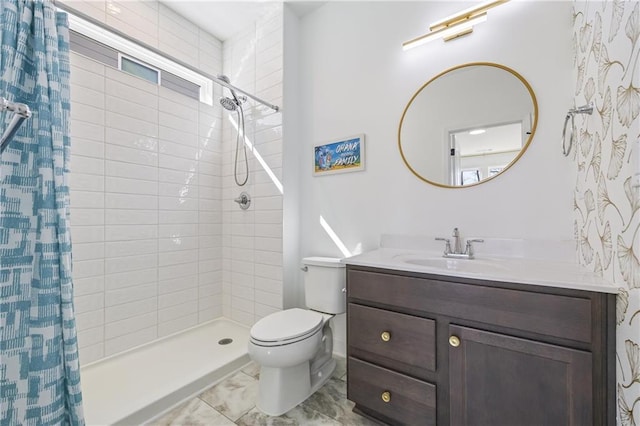 bathroom featuring walk in shower, vanity, and toilet