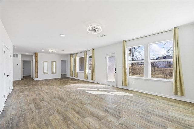 unfurnished living room featuring light wood-type flooring