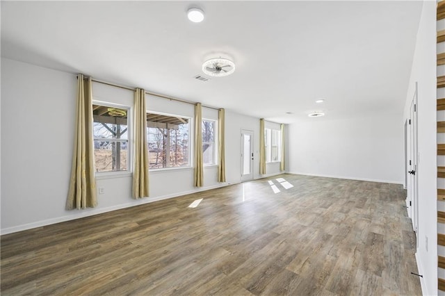 spare room featuring dark wood-type flooring