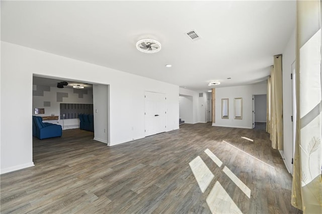 unfurnished living room with dark hardwood / wood-style flooring