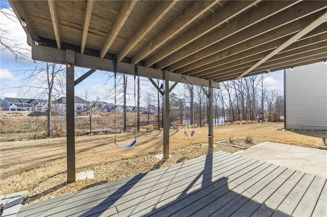 wooden terrace featuring a patio