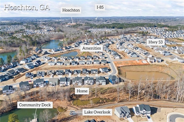 birds eye view of property with a water view