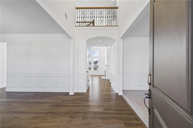 foyer featuring dark wood-type flooring