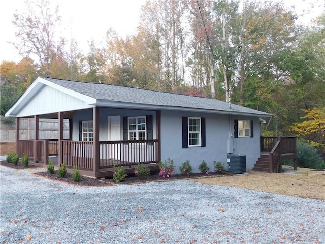 ranch-style house with covered porch and central AC