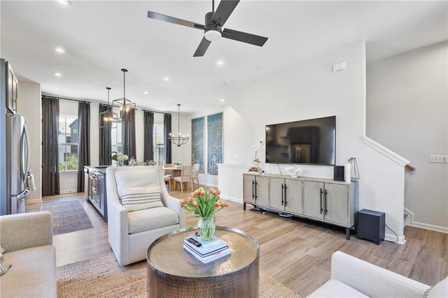 126 Chestnut Cir, Atlanta, GA 30342 - living area featuring recessed lighting, light wood finished floors, baseboards, ceiling fan, and a chandelier