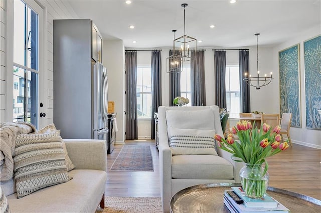 126 Chestnut Cir, Atlanta, GA 30342 - living area with a chandelier, light wood-type flooring, plenty of natural light, recessed lighting, and baseboards