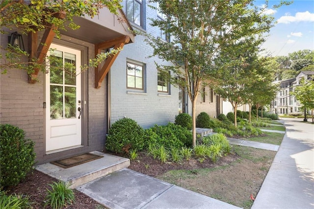 126 Chestnut Cir, Atlanta, GA 30342 - view of exterior entry featuring brick siding